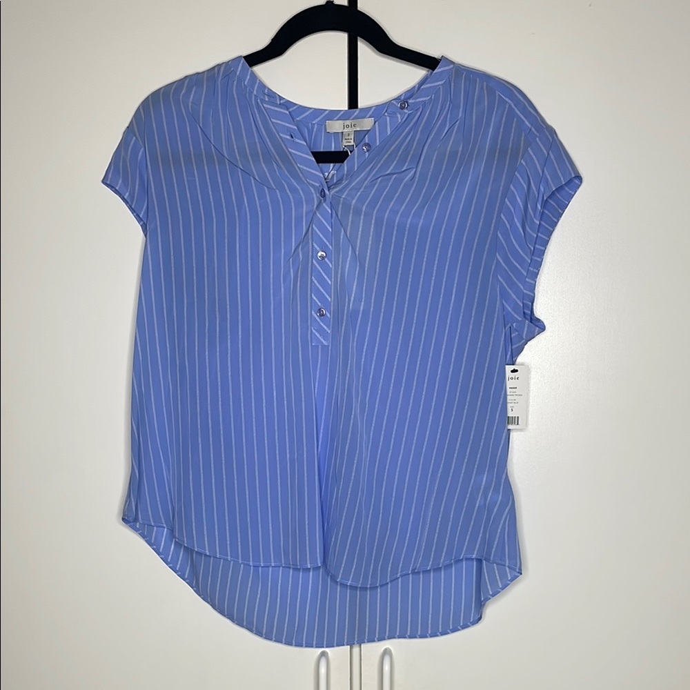 Sky blue with white vertical detailed stripes and V neck.